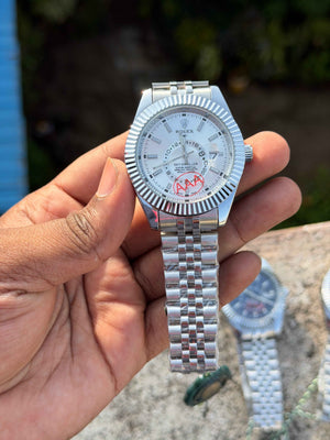 Rolex Sky-Dweller features a prominent fluted bezel and a silver dial.