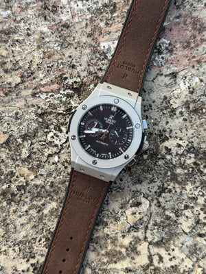 Hublot Big Bang Chronograph features a titanium case with a brown leather - OM SAI TIMEPIECE