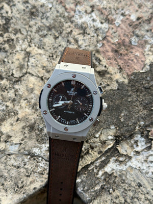 Hublot Big Bang Chronograph features a titanium case with a brown leather - OM SAI TIMEPIECE