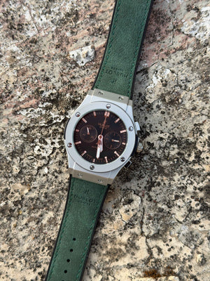 Hublot Classic Fusion Chronograph features a distinctive green - OM SAI TIMEPIECE