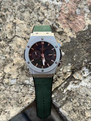 Hublot Classic Fusion Chronograph features a distinctive green - OM SAI TIMEPIECE