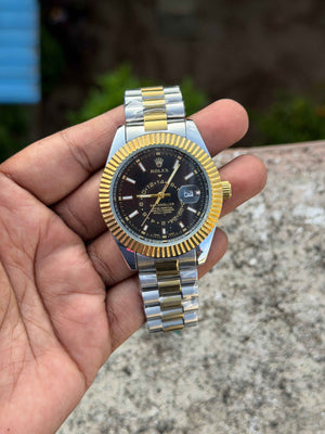 Rolex Sky-Dweller watch featuring a black dial and a two-tone gold and steel bracelet.