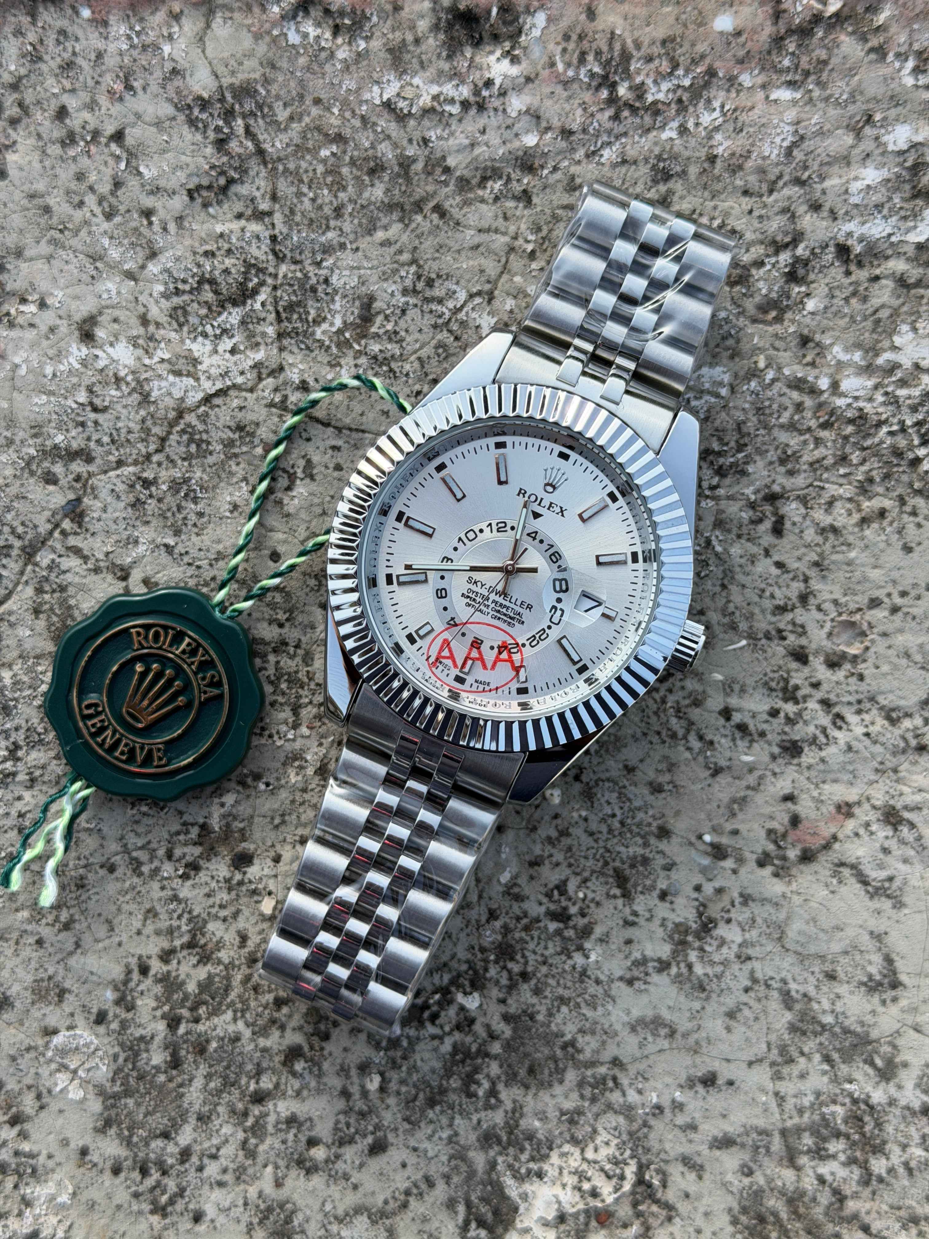 Rolex Sky-Dweller features a prominent fluted bezel and a silver dial.