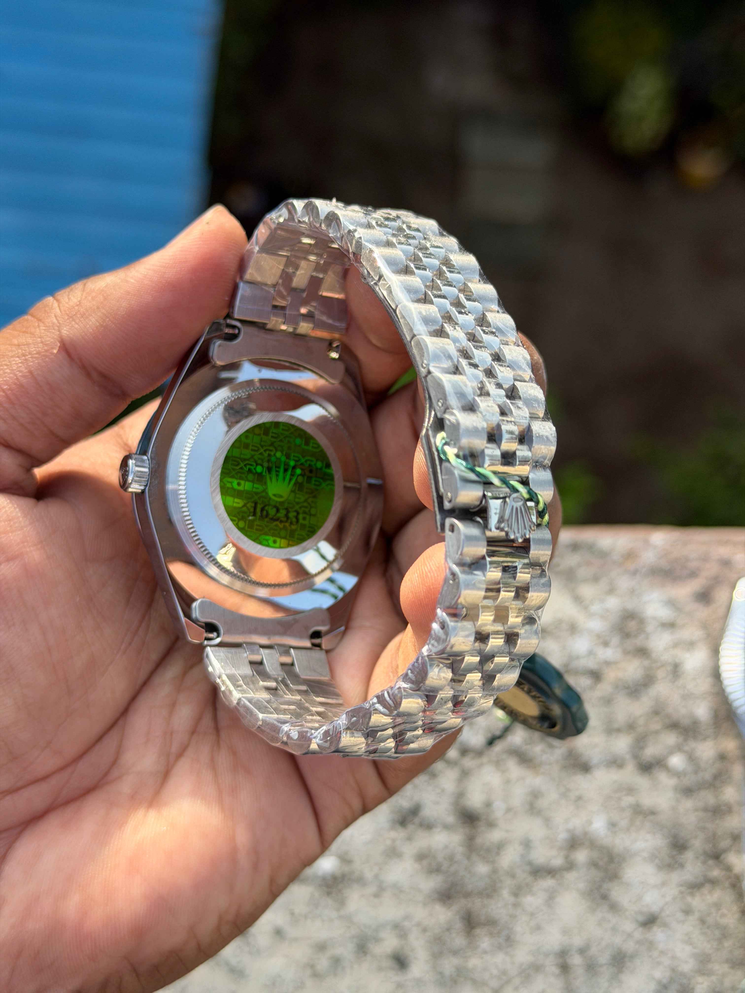 Rolex Sky-Dweller features a prominent fluted bezel and a silver dial.