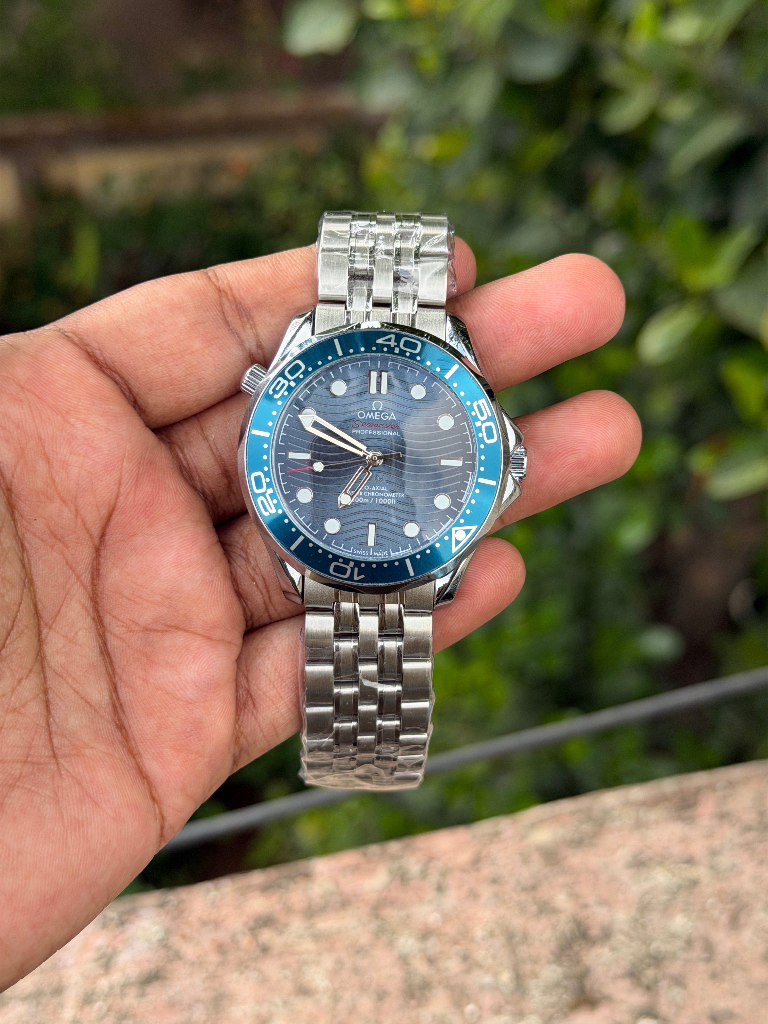 Omeg@ Seamaster Automatic Movement Diver 300M features a distinctive blue ceramic dial with laser-engraved waves- FC